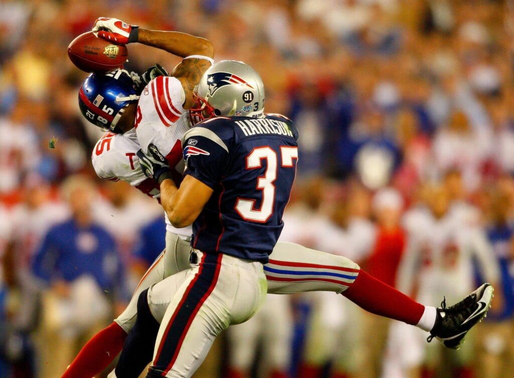Giants receiver David Tyree catches a pass while in the clutches of Patriots safety Rodney Harrison en route to New York's 17-14 victory over New England in Super Bowl XLII. Lynn, Mass., cat burglar Sean Murphy, a diehard Patriots fan, sought revenge by stealing the Giants' Super Bowl rings from an Attleboro jewelry maker.
NEW: Super Bowl