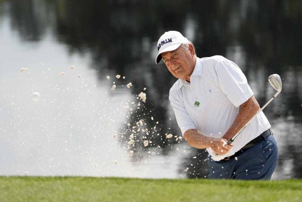 Apr 6, 2022; Augusta, Georgia, USA; Raymond Floyd hits out of a bunker on no. 4 during the Par 3 Contest at The Masters golf tournament at Augusta National Golf Club. Mandatory Credit: Michael Madrid-USA TODAY Sports
