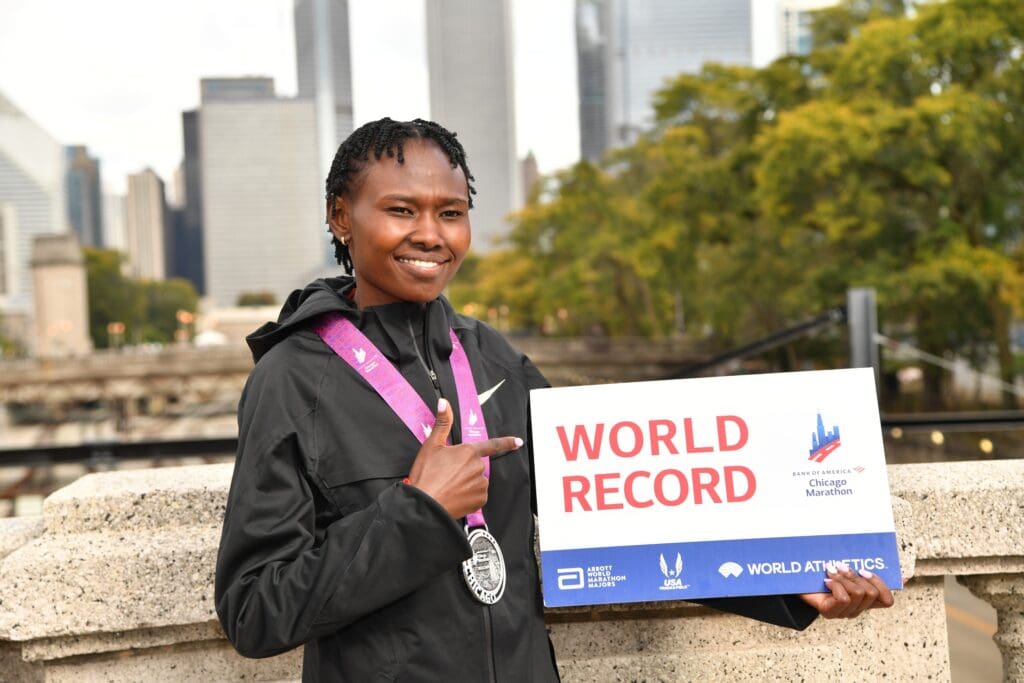 Oct 13, 2024; Chicago, IL, USA; Ruth Chepngetich of Kenya poses for a photo after finishing first in the womens race, setting a new world record at 2:09:56 during the Chicago Marathon at Grant Park. Mandatory Credit: Patrick Gorski-Imagn Images
