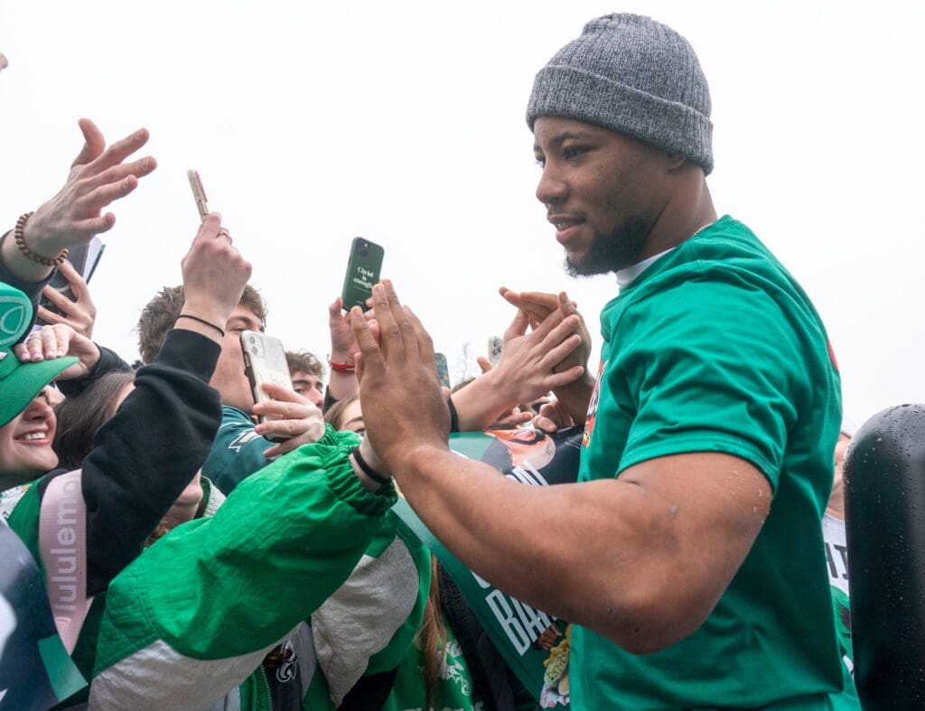 Philadelphia Eagles running back Saquon Barkley greets fans outside of Raising Cane’s Chicken Fingers in Bensalem on Thursday, Feb. 13, 2025.