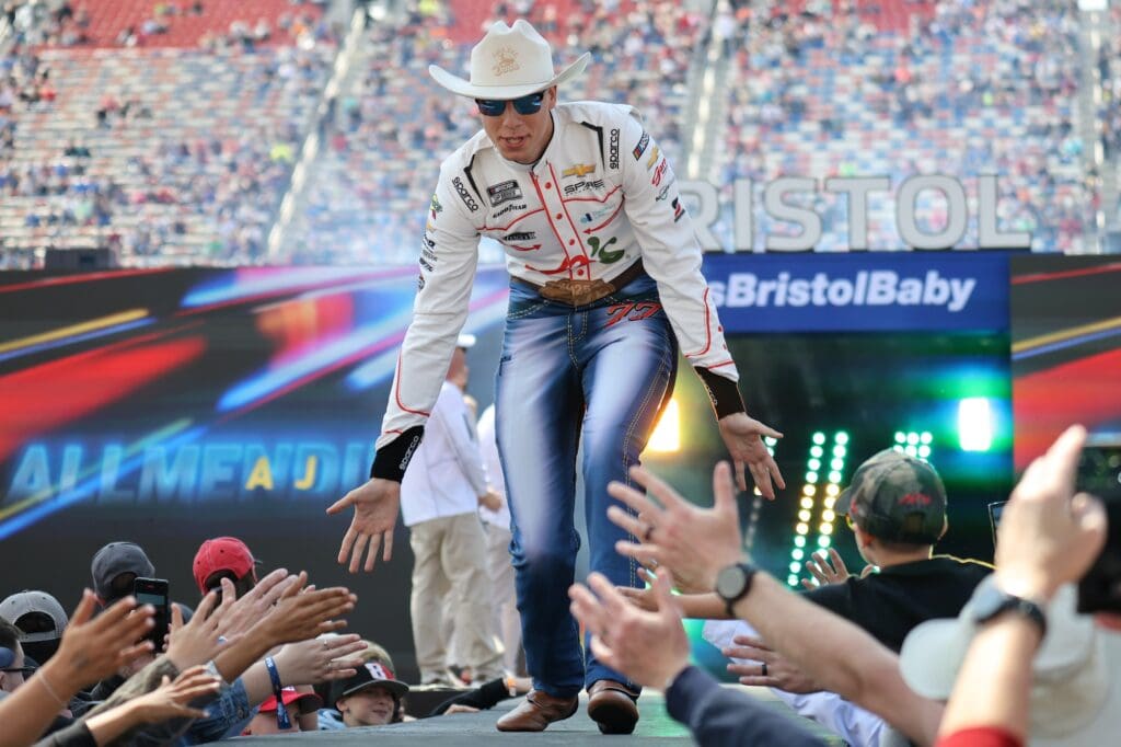 Apr 13, 2025; Bristol, Tennessee, USA; NASCAR Cup Series driver Carson Hocevar (77) during driver introductions for the NASCAR Food City 500 at Bristol Motor Speedway. Mandatory Credit: Randy Sartin-Imagn Images