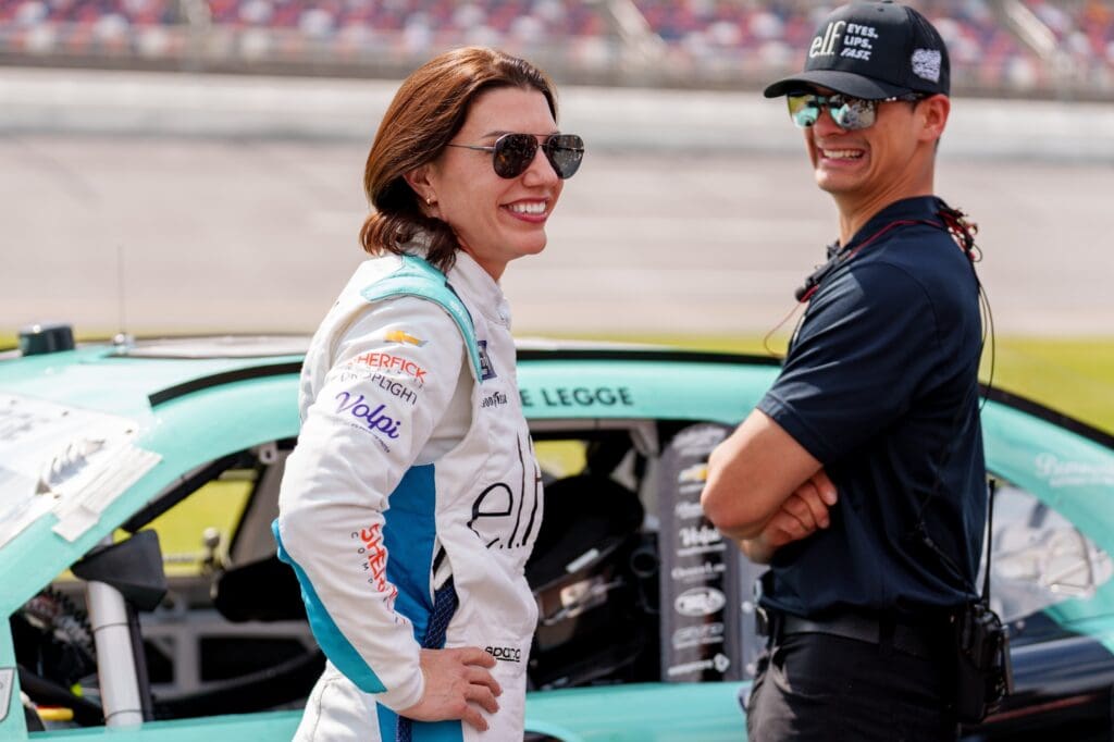 Apr 26, 2025; Talladega, Alabama, USA; Xfinity Series driver Katherine Legge (32) speaks with fans before the race at Talladega Superspeedway. Mandatory Credit: Jason Allen-Imagn Images