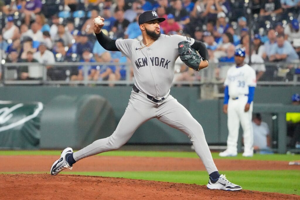 Jun 12, 2025; Kansas City, Missouri, USA; New York Yankees relief pitcher Devin Williams (38) delivers a pitch against the Kansas City Royals in the ninth inning at Kauffman Stadium. Mandatory Credit: Denny Medley-Imagn Images