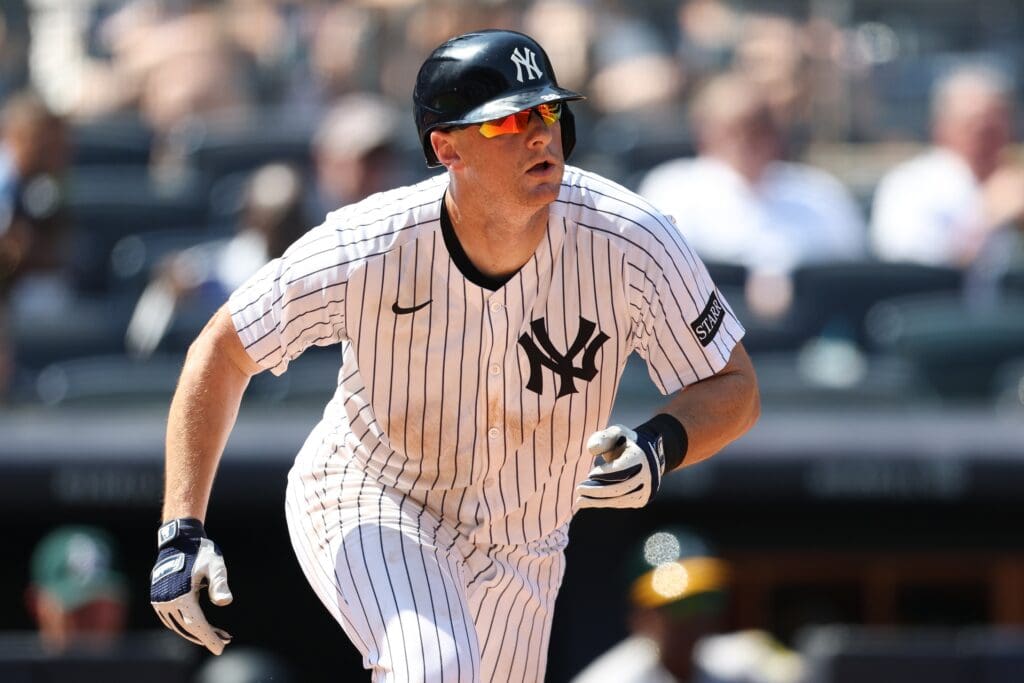 Jun 28, 2025; Bronx, New York, USA; New York Yankees second base DJ LeMahieu (26) singles during the eighth inning against the Athletics at Yankee Stadium. Mandatory Credit: Vincent Carchietta-Imagn Images