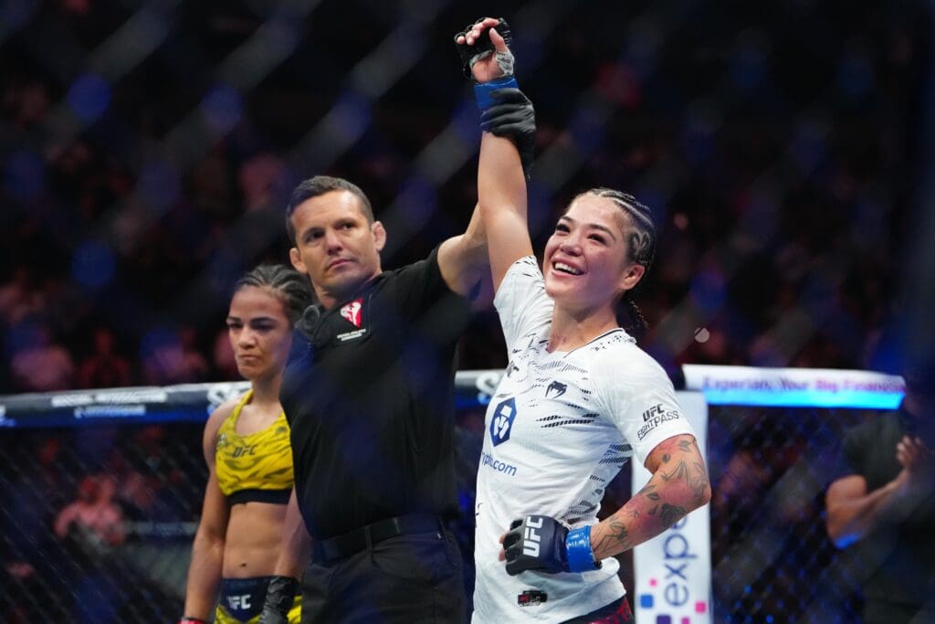 Jun 28, 2025; Las Vegas, Nevada, USA; Tracy Cortez (blue gloves) racist after the fight against Viviane Araujo (red gloves) during UFC 317 at T-Mobile Arena. Mandatory Credit: Stephen R. Sylvanie-Imagn Images