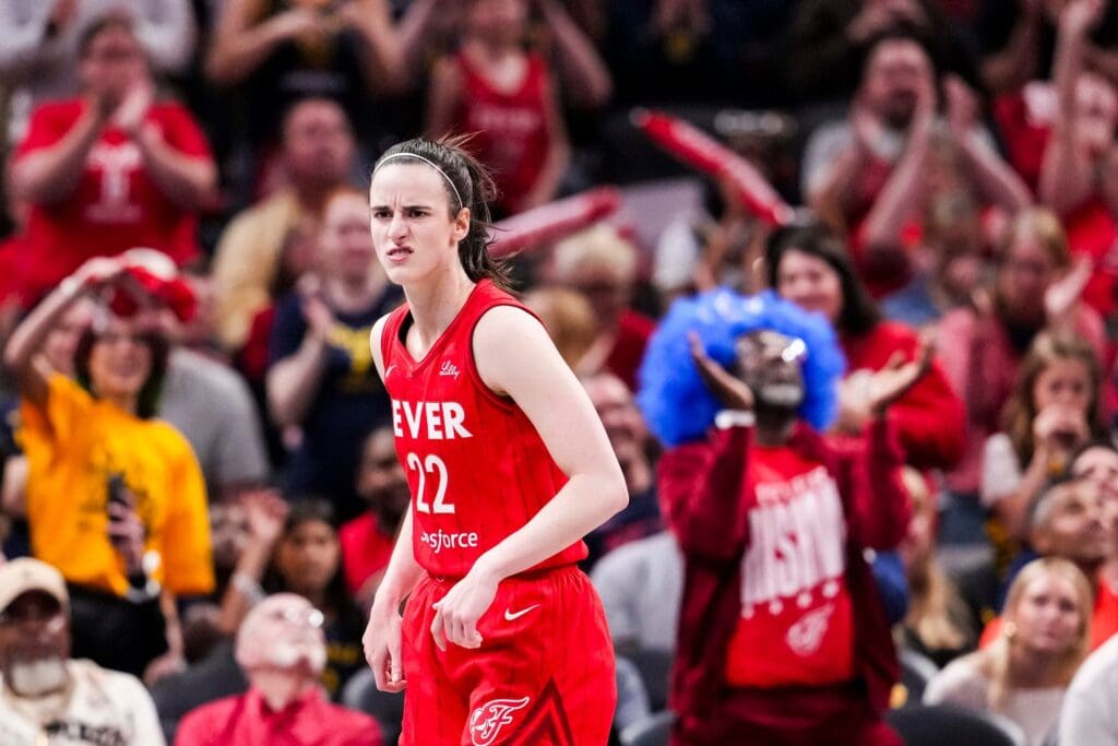 Indiana Fever guard Caitlin Clark reacts to scoring a 3-pointer Saturday, May 17, 2025, during a game against the Chicago Sky at Gainbridge Fieldhouse in Indianapolis.