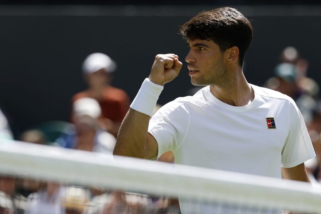 Jun 30, 2025; Wimbledon, United Kingdom; Carlos Alcaraz (ESP) reacts after winning a point against Fabio Fognini (ITA)(not pictured) on day one of The Championships, Wimbledon 2025 at All England Lawn Tennis and Croquet Club. Mandatory Credit: Geoff Burke-Imagn Images