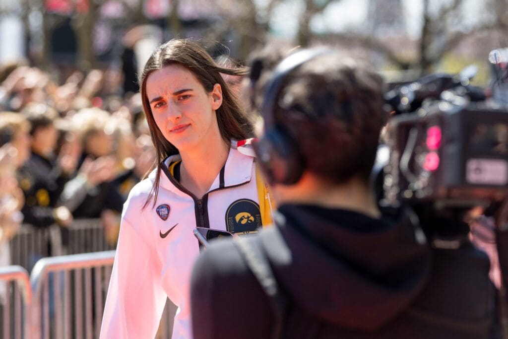 Iowa Hawkeyes guard Caitlin Clark (22) arrives for the NCAA Tournament championship basketball game at Rocket Mortgage Fieldhouse, Sunday, April 7, 2024 in Cleveland.