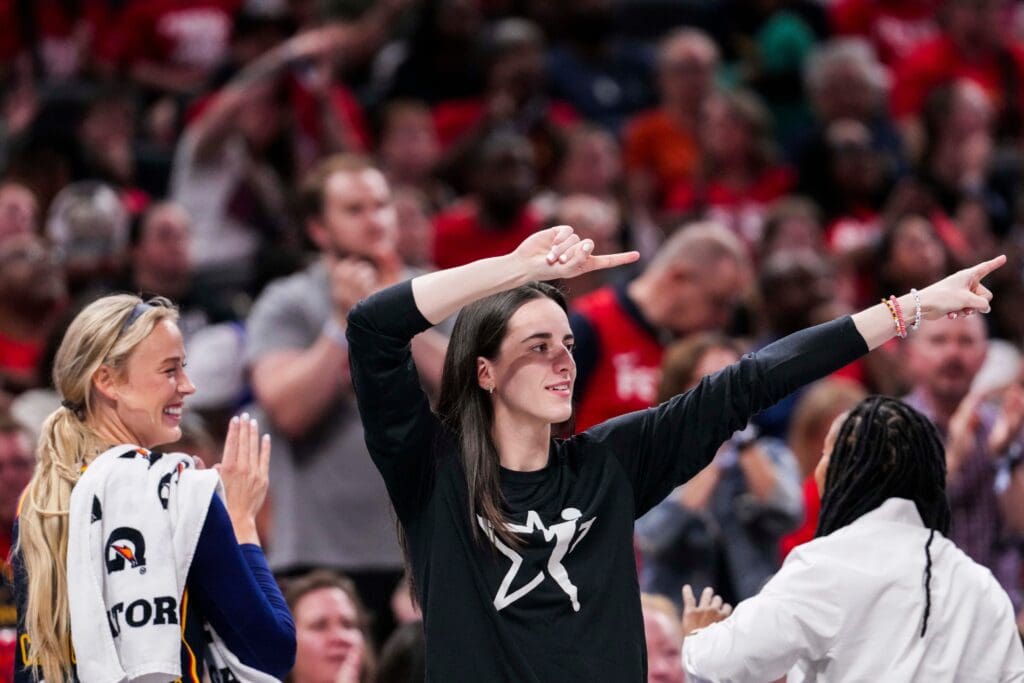 Indiana Fever guard Sophie Cunningham (8) and Indiana Fever guard Caitlin Clark (22) celebrate from the bench Thursday, July 3, 2025, during a game between the Indiana Fever and the Las Vegas Aces at Gainbridge Fieldhouse in Indianapolis.