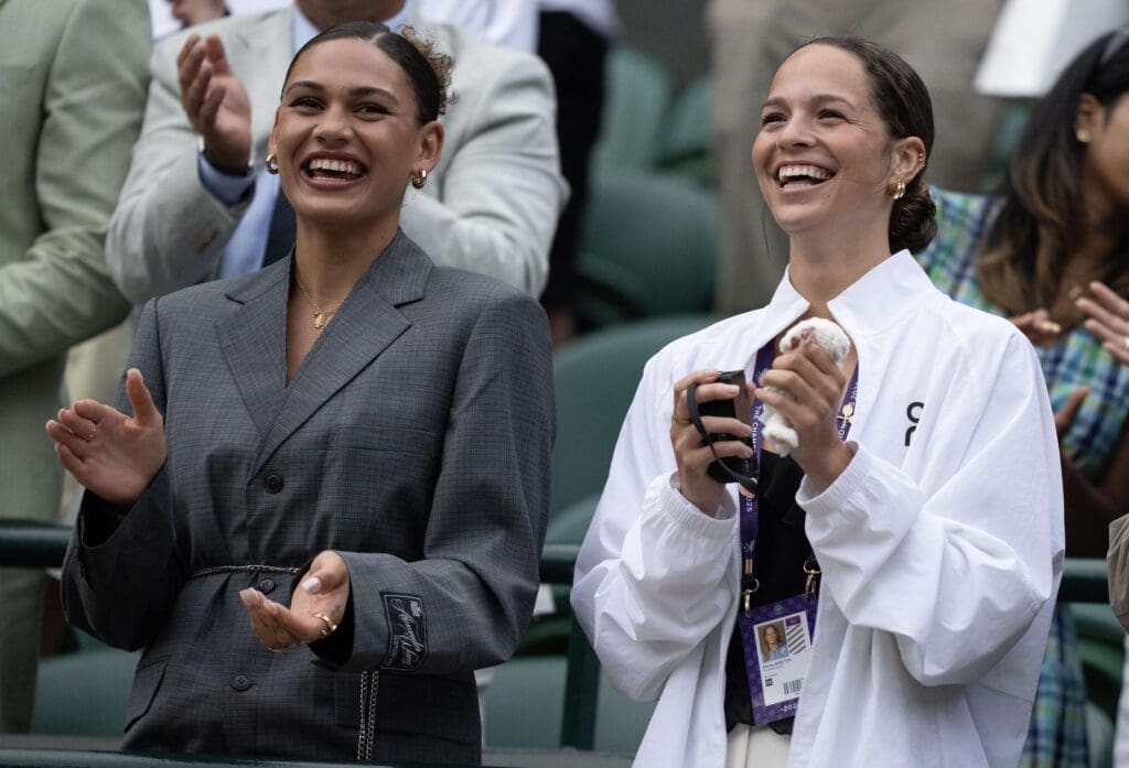 Jul 5, 2025; Wimbledon, United Kingdom; Trinity Rodman and Emma Shelton in attendance for the Ben Shelton of the United States and Marton Fucsovics of Hungary (both not pictured) match on day six at the All England Lawn Tennis and Croquet Club. Mandatory Credit: Susan Mullane-Imagn Images