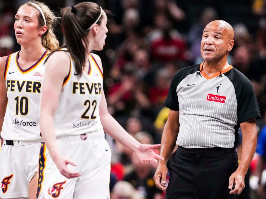 Indiana Fever guard Caitlin Clark (22) talks with an official Wednesday, July 9, 2025, during a game between the Indiana Fever and the Golden State Valkyries at Gainbridge Fieldhouse in Indianapolis.