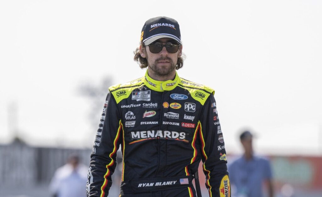 Jul 12, 2025; Sonoma, California, USA; NASCAR Cup Series driver Ryan Blaney (12) walks to his vehicle in preparation for a practice run at Sonoma Raceway. Mandatory Credit: Stan Szeto-Imagn Images