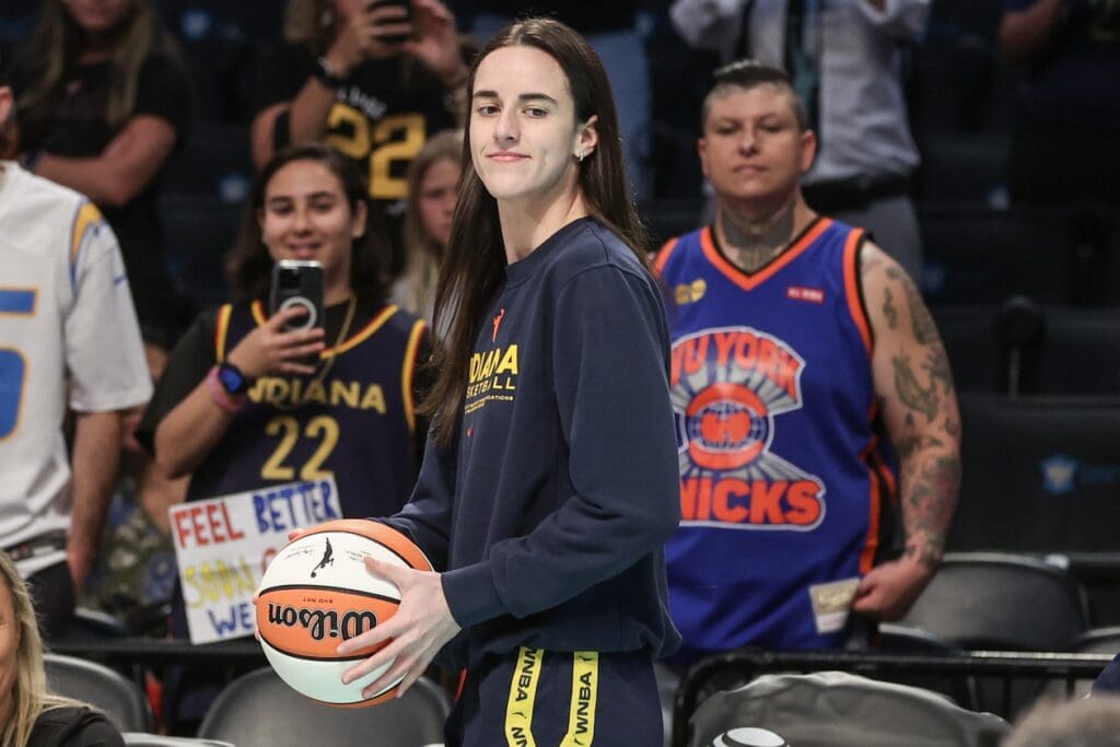 Jul 22, 2025; Brooklyn, New York, USA; Indiana Fever guard Caitlin Clark (22) walks onto the court prior to the game against the New York Liberty at Barclays Center. Mandatory Credit: Wendell Cruz-Imagn Images