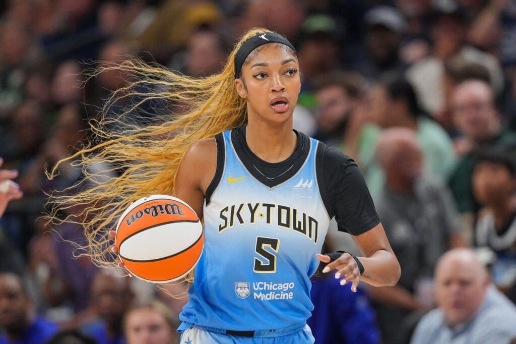 Jul 22, 2025; Minneapolis, Minnesota, USA; Chicago Sky forward Angel Reese (5) dribbles against the Minnesota Lynx in the first quarter at Target Center. Mandatory Credit: Brad Rempel-Imagn Images