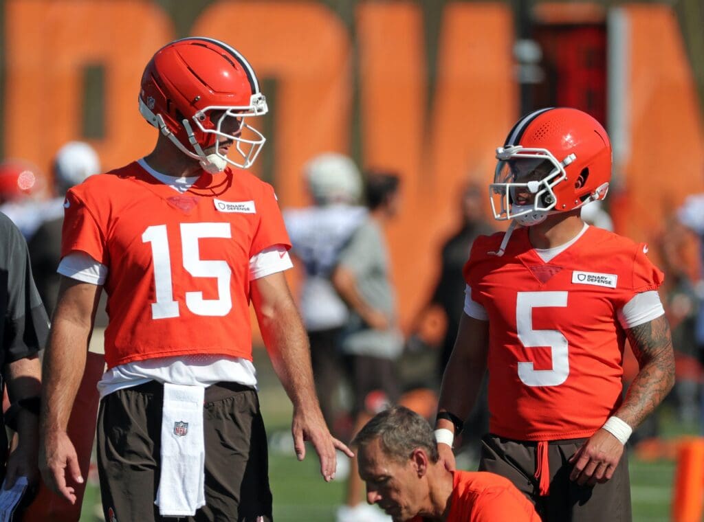 Cleveland Browns quarterback Joe Flacco (15) chats with quarterback Dillon Gabriel (5) during NFL training camp practice at the Cleveland Browns training facility, Wednesday, July 23, 2025, in Berea, Ohio.