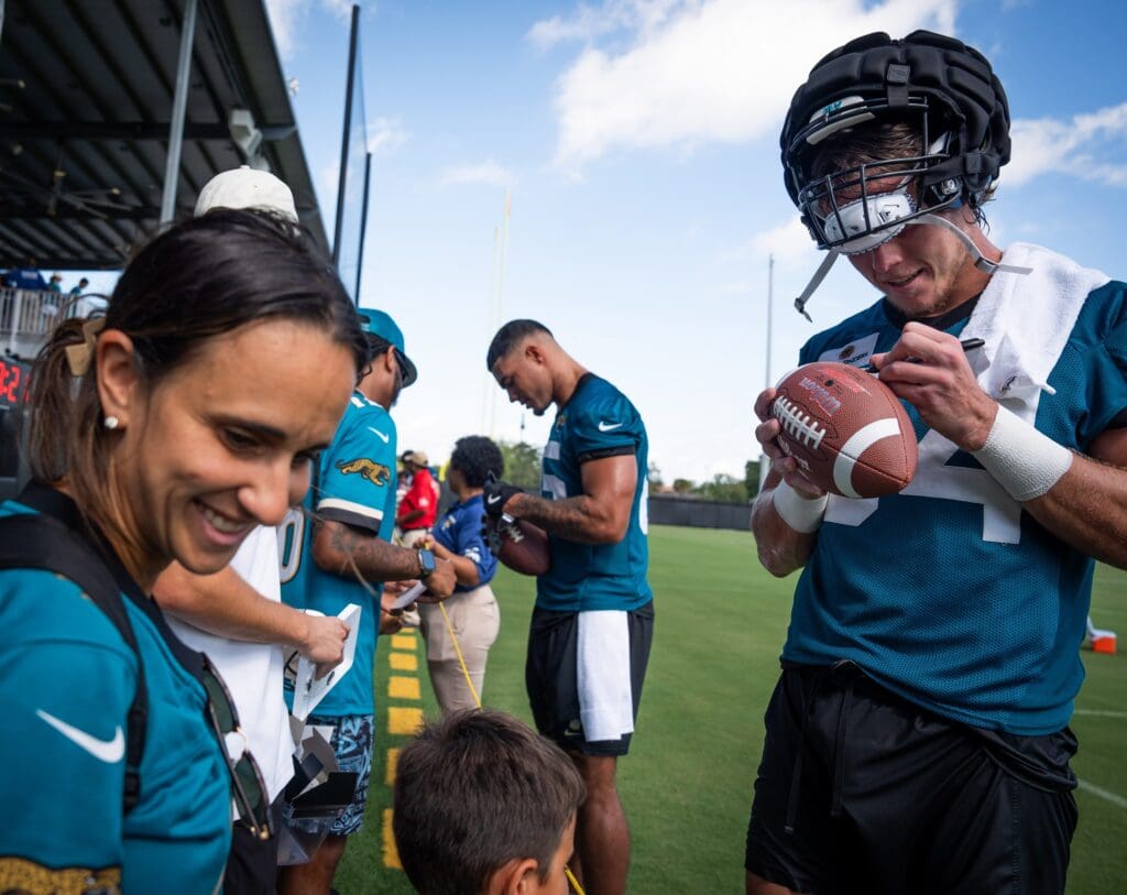 Jacksonville Jaguars tight end Hunter Long (84) autographs a football for fans after the NFL training camp second session at the Miller Electric Center, Thursday, July 24, 2025, in Jacksonville, Fla. [Doug Engle/Florida Times-Union]