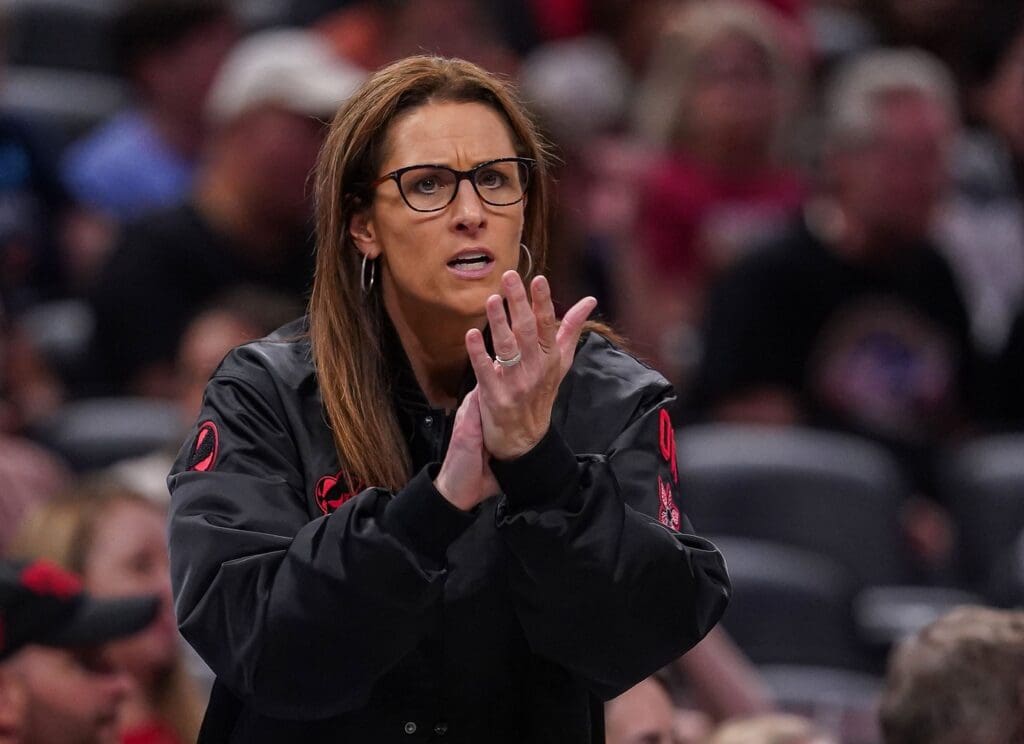Indiana Fever head coach Stephanie White claps her hands in excitement Thursday, July 24, 2025, during the game at Gainbridge Fieldhouse in Indianapolis.