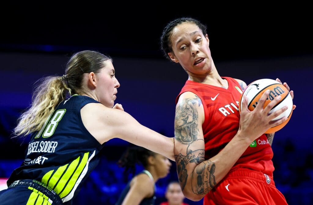 Jul 30, 2025; Arlington, Texas, USA; Atlanta Dream center Brittney Griner (42) looks to score as Dallas Wings center Luisa Geiselsoder (18) defends during the first half at College Park Center. Mandatory Credit: Kevin Jairaj-Imagn Images