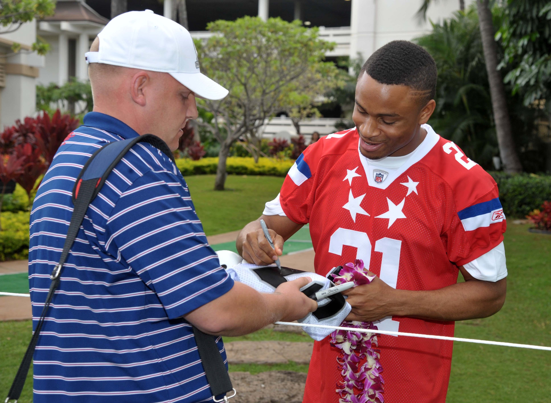 Jan 28, 2011; Ko Olina, HI, USA; Oakland Raiders corneback Nnamdi Asomugha (21) signs an autograph at AFC media day at the JW Marriott Ihilani Resort for the 2011 Pro Bowl. Mandatory Credit: Kirby Lee/Image of Sport-USA TODAY Sports