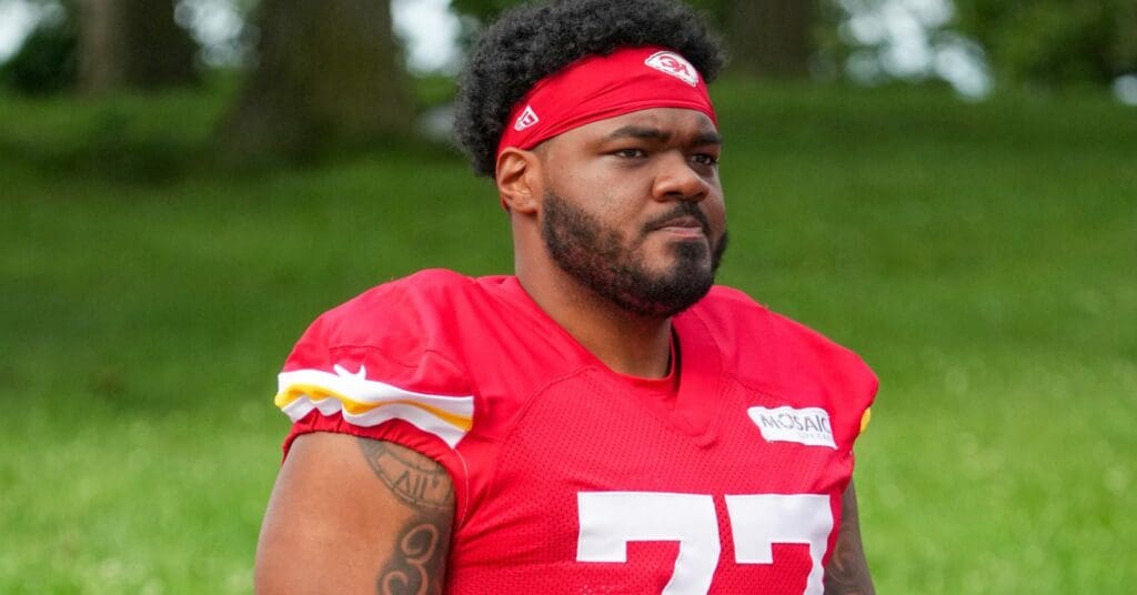 Jul 22, 2025; St. Joseph, MO, USA; Kansas City Chiefs guard Jaylon Moore (77) walks down the hill to the practice fields during training camp at Missouri Western State University. Mandatory Credit: Denny Medley-Imagn Images