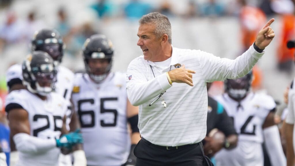 Sep 19, 2021; Jacksonville, Florida, USA; Jacksonville Jaguars head coach Urban Meyer reacts in the huddle with his players against the Denver Broncos at TIAA Bank Field.