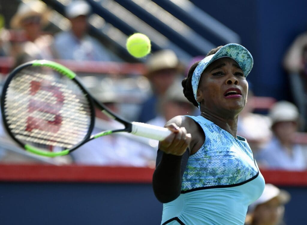 Aug 6, 2018; Montreal, Quebec, Canada; Venus Williams of the United States hits a forehand against Caroline Dolehide of the United States (not pictured) in the Rogers Cup tennis tournament at Stade IGA.