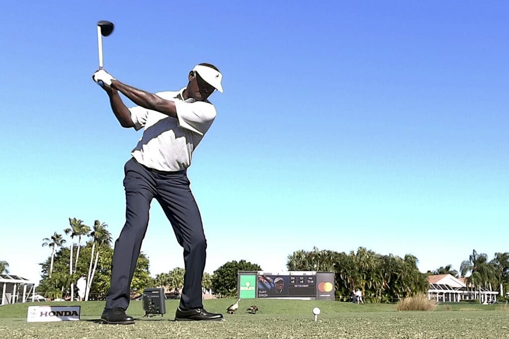 Feb 27, 2020; Palm Beach Gardens, Florida, USA; Vijay Singh hits his tee shot on the 13th hole during the first round of the 2020 Honda Classic golf tournament at PGA National (Champion).