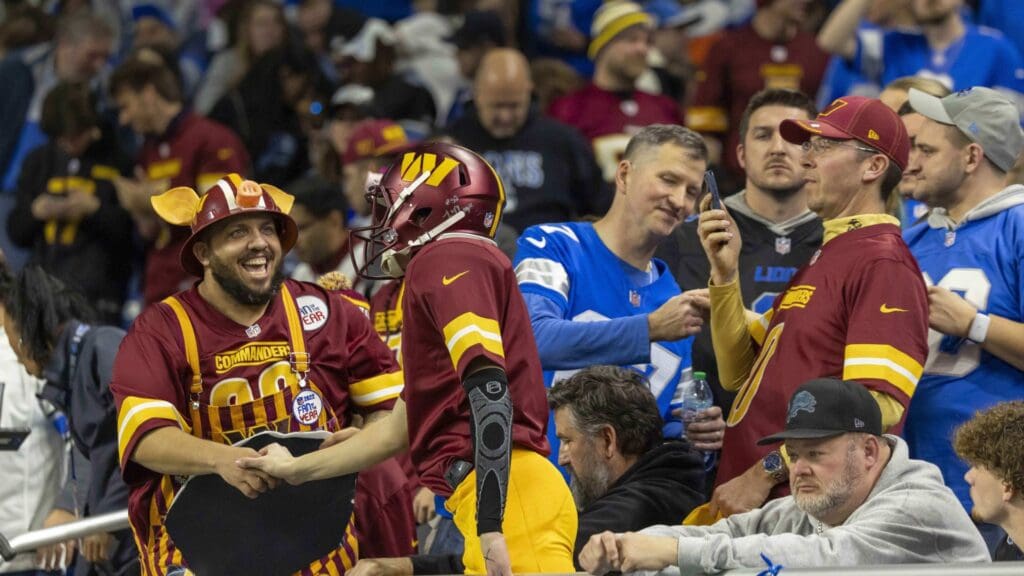 Jan 18, 2025; Detroit, Michigan, USA; Washington Commanders fans celebrate during the second half against Detroit Lions at Ford Field.