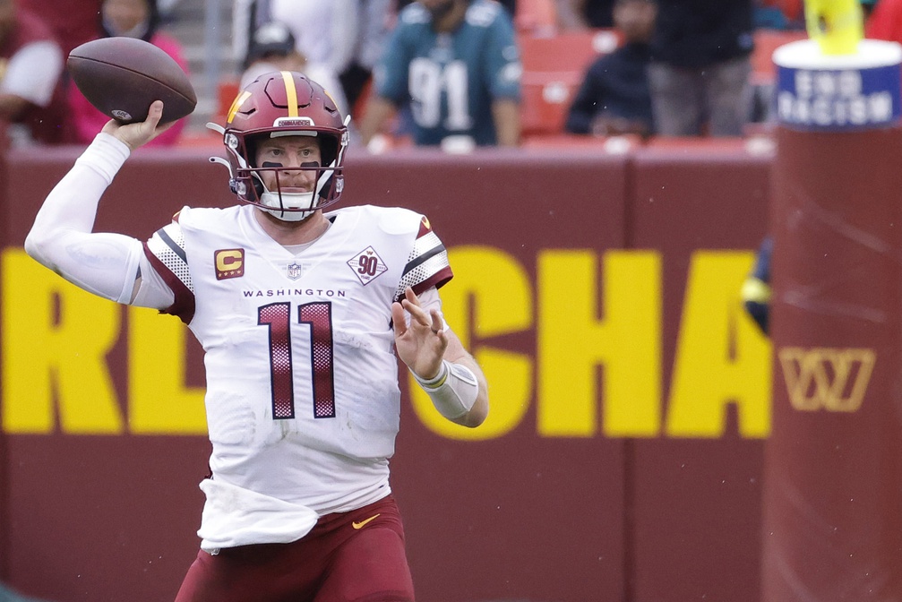 Sep 25, 2022; Landover, Maryland, USA; Washington Commanders quarterback Carson Wentz (11) passes the ball against the Philadelphia Eagles at FedExField.