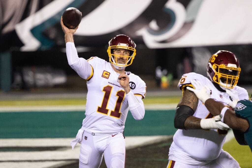 Jan 3, 2021; Philadelphia, Pennsylvania, USA; Washington Football Team quarterback Alex Smith (11) passes the ball against the Philadelphia Eagles during the first quarter at Lincoln Financial Field.