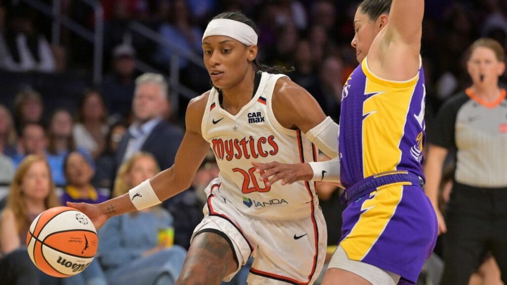 Jul 15, 2025; Los Angeles, California, USA; Washington Mystics guard Brittney Sykes (20) is defended by Los Angeles Sparks guard Kelsey Plum (10) during the second half at Crypto.com Arena.