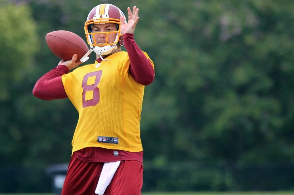 Aug 6, 2013; Richmond, VA, USA; Washington Redskins quarterback Rex Grossman (8) throws the ball during afternoon practice as part of the 2013 NFL training camp at the Bon Secours Washington Redskins Training Center.