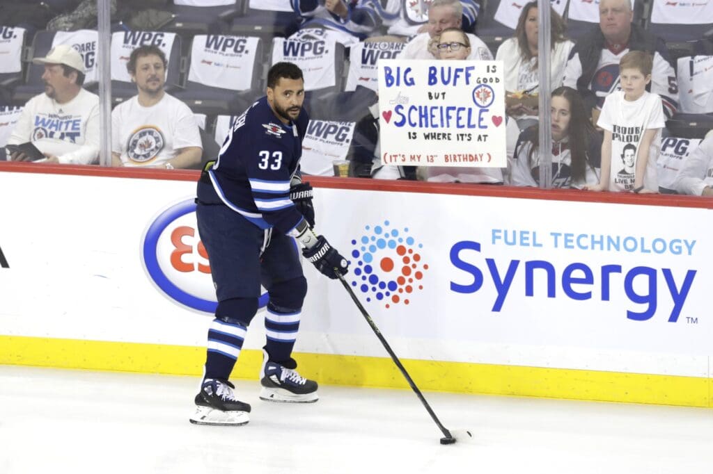 Apr 10, 2019; Winnipeg, Manitoba, CAN; Winnipeg Jets defenseman Dustin Byfuglien (33) skates past fans prior to the game against the St. Louis Blues in game one of the first round of the 2019 Stanley Cup Playoffs at Bell MTS Place. 