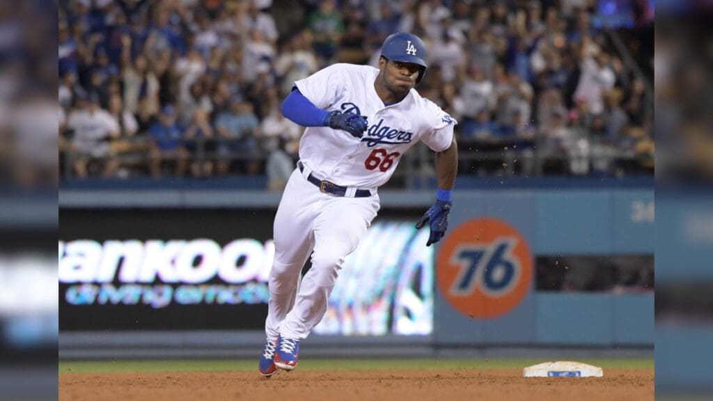 May 3, 2017; Los Angeles, CA, USA; Los Angeles Dodgers right fielder Yasiel Puig (66) rounds second base on a three-base error in the sixth inning against the San Francisco Giants during a MLB game at Dodger Stadium. The Giants defeated the Dodgers 4-1 in 11 innings.