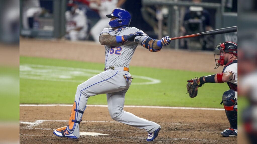 Aug 1, 2020; Atlanta, Georgia, USA; New York Mets left fielder Yoenis Cespedes (52) bats against the Atlanta Braves in the fifth inning at Truist Park.