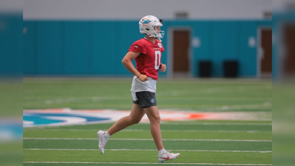 Jun 10, 2025; Miami, FL, USA; Miami Dolphins quarterback Zach Wilson (0) runs on the field during mandatory minicamp at Hard Rock Stadium.