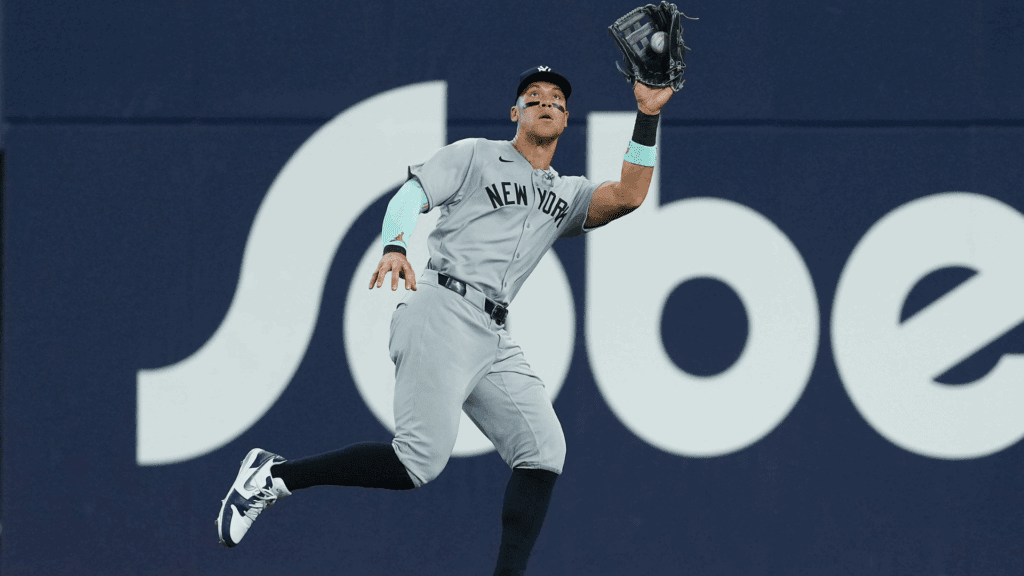 Jul 21, 2025; Toronto, Ontario, CAN; New York Yankees right fielder Aaron Judge (99) catches a fly ball for the out against the Toronto Blue Jays during the seventh inning at Rogers Centre.