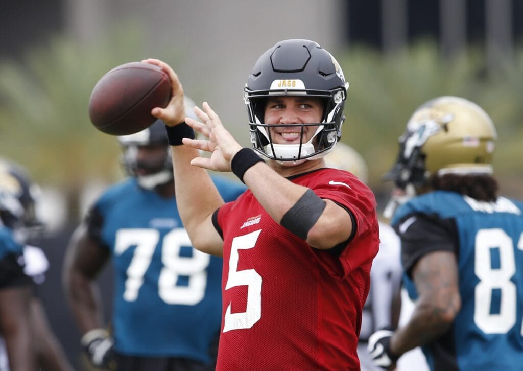 Jul 27, 2017; Jacksonville, FL, USA; Jacksonville Jaguars quarterback Blake Bortles (5) throws the ball after receiving IV liquids in his left arm during drills at the Jacksonville Jaguars training camp at EverBank Field.