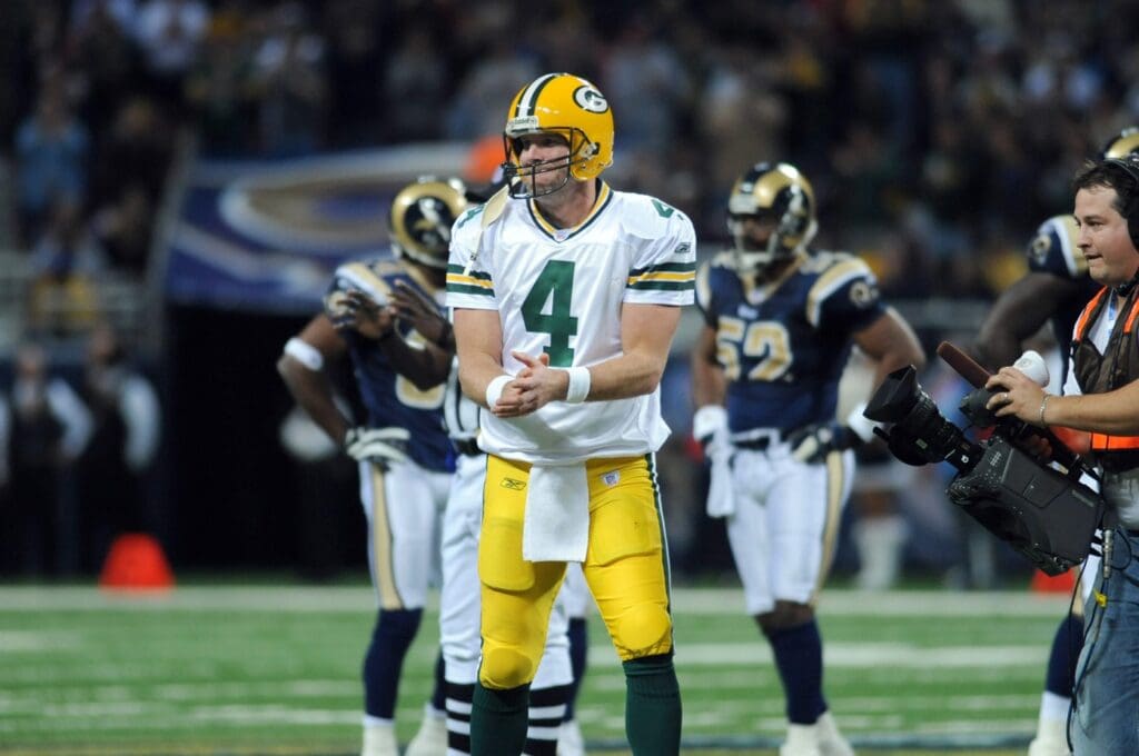 December 16, 2007; St. Louis, MO, USA; Green Bay Packers quarterback Brett Favre (4) celebrates after making the record-breaking pass in the fourth quarter against the St. Louis Rams at the Edward Jones Dome, St. Louis, MO. Favre now holds the record for career passing yards. The Packers won 30-14.