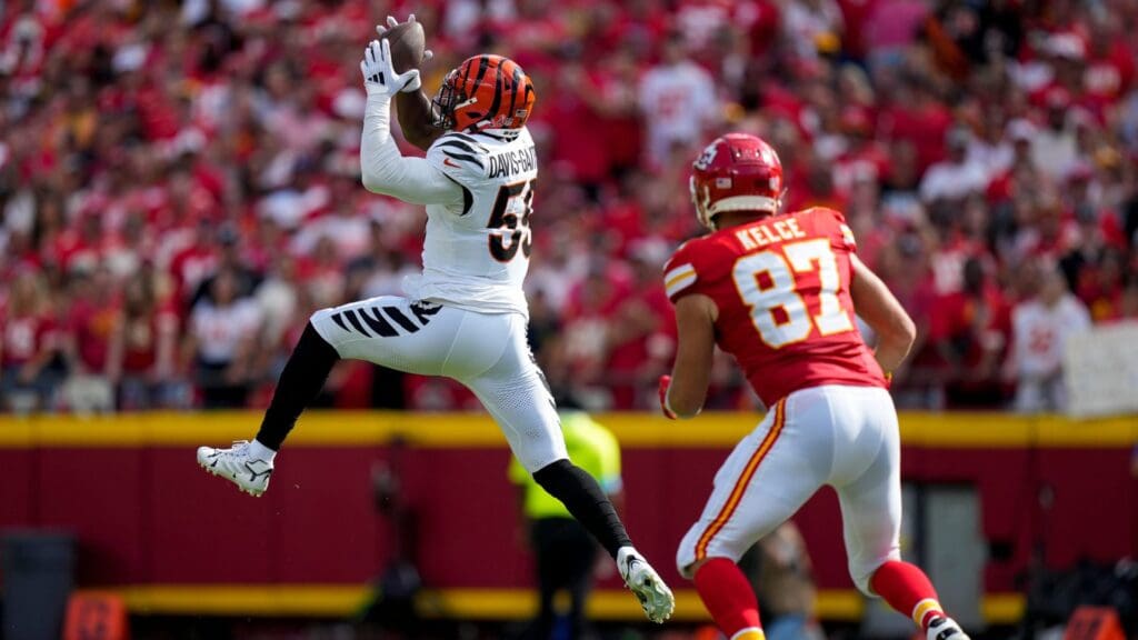 Cincinnati Bengals linebacker Akeem Davis-Gaither (59) intercepts a pass intended for Kansas City Chiefs tight end Travis Kelce (87) in the first quarter of the NFL Week 2 game between the Kansas City Chiefs and the Cincinnati Bengals at Arrowhead Stadium in Kansas City on Sunday, Sept. 15, 2024. The Bengals led 16-10 at halftime.