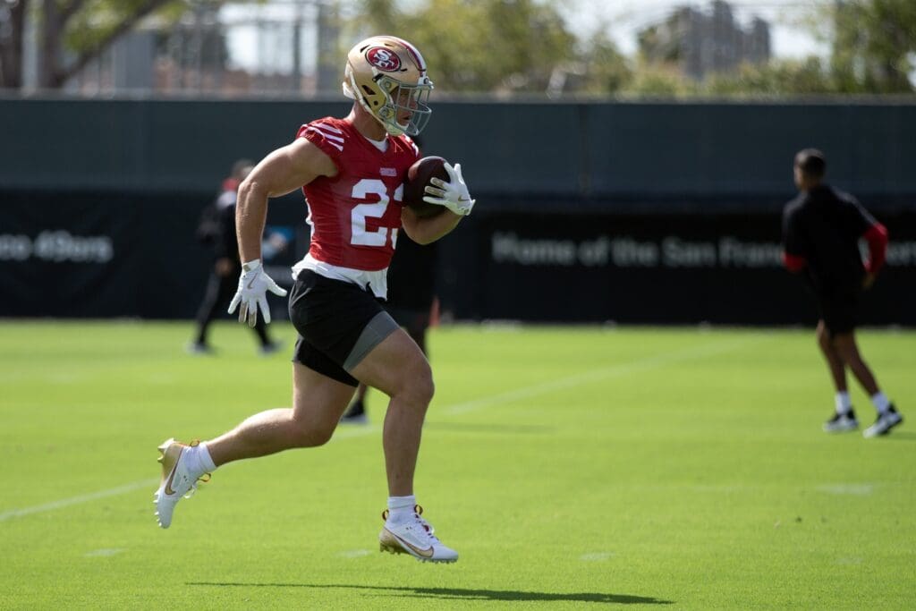 Jul 23, 2025; Santa Clara, CA, USA; San Francisco 49ers running back Christian McCaffrey (23) runs a play during the first day of training camp at SAP Performance Facility.