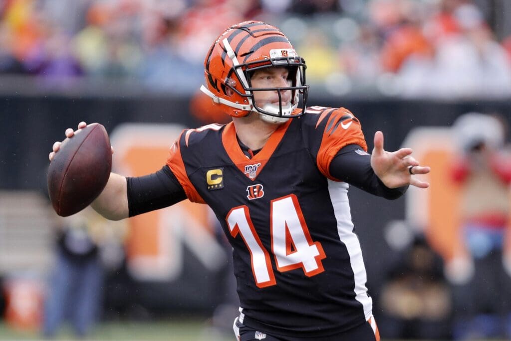 Dec 29, 2019; Cincinnati, Ohio, USA; Cincinnati Bengals quarterback Andy Dalton (14) throws the ball against the Cleveland Browns during the first half at Paul Brown Stadium.