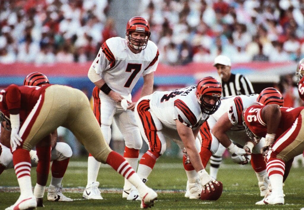 Jan 22, 1989; Miami, FL, USA; FILE PHOTO; Cincinnati Bengals quarterback Boomer Esiason (7) and Bruce Kozerski (64) at the line of scrimmage against the San Francisco 49ers during Super Bowl XXIII at Joe Robbie Stadium. The 49ers defeated the Bengals 20-16. 