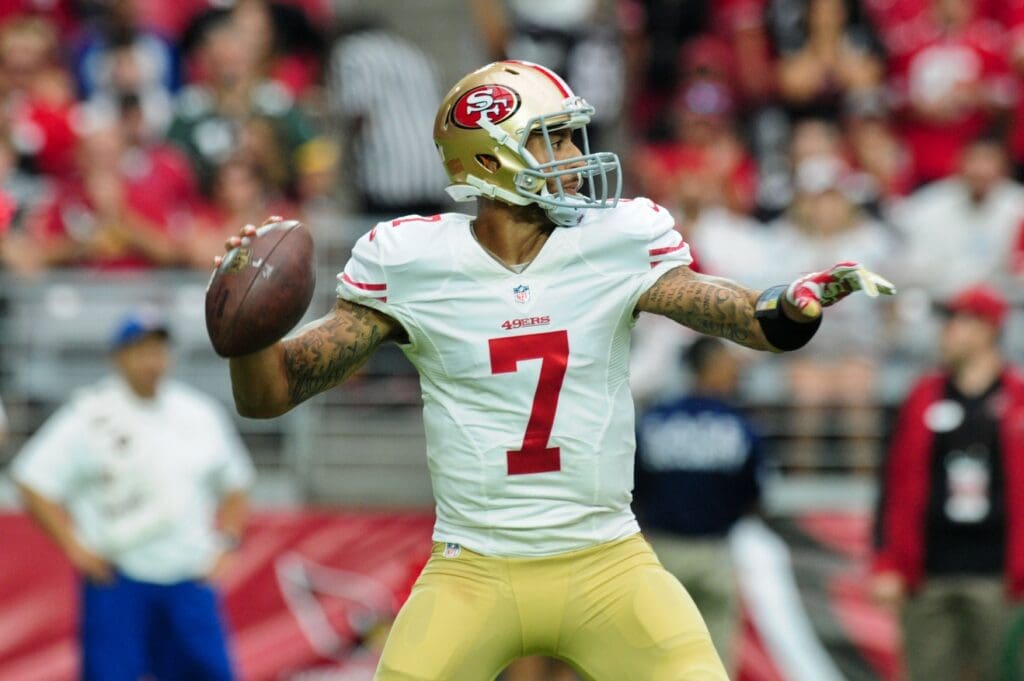 Sep 21, 2014; Glendale, AZ, USA; San Francisco 49ers quarterback Colin Kaepernick (7) throws during the first half against the Arizona Cardinals at University of Phoenix Stadium
