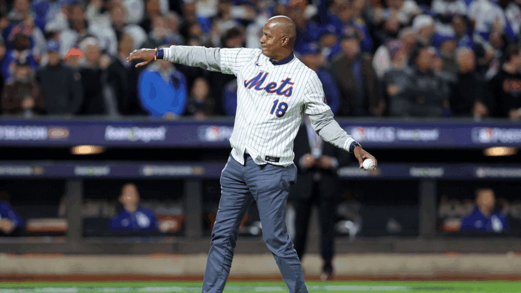 Oct 16, 2024; New York City, New York, USA; Former New York Mets pitch Darryl Strawberry throws out the ceremonial first pitch against the Los Angeles Dodgers before game three of the NLCS for the 2024 MLB playoffs at Citi Field.