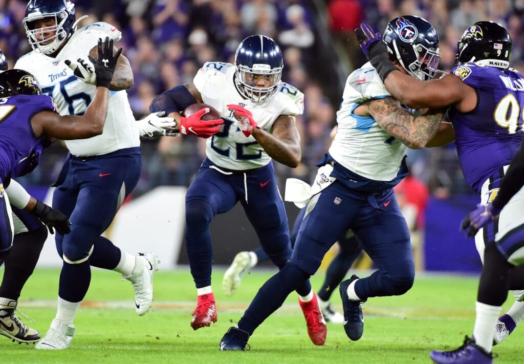 Jan 11, 2020; Baltimore, Maryland, USA; Tennessee Titans running back Derrick Henry (22) runs with the ball in the first quarter against the Baltimore Ravens in a AFC Divisional Round playoff football game at M&T Bank Stadium.