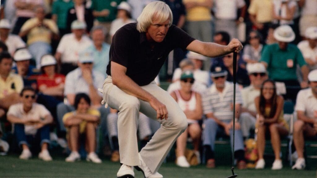 4/9/1981; Augusta, Georgia, USA; Greg Norman lining up putt with spectators in background at the Augusta National GC.