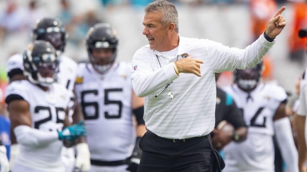 Sep 19, 2021; Jacksonville, Florida, USA; Jacksonville Jaguars head coach Urban Meyer reacts in the huddle with his players against the Denver Broncos at TIAA Bank Field. 