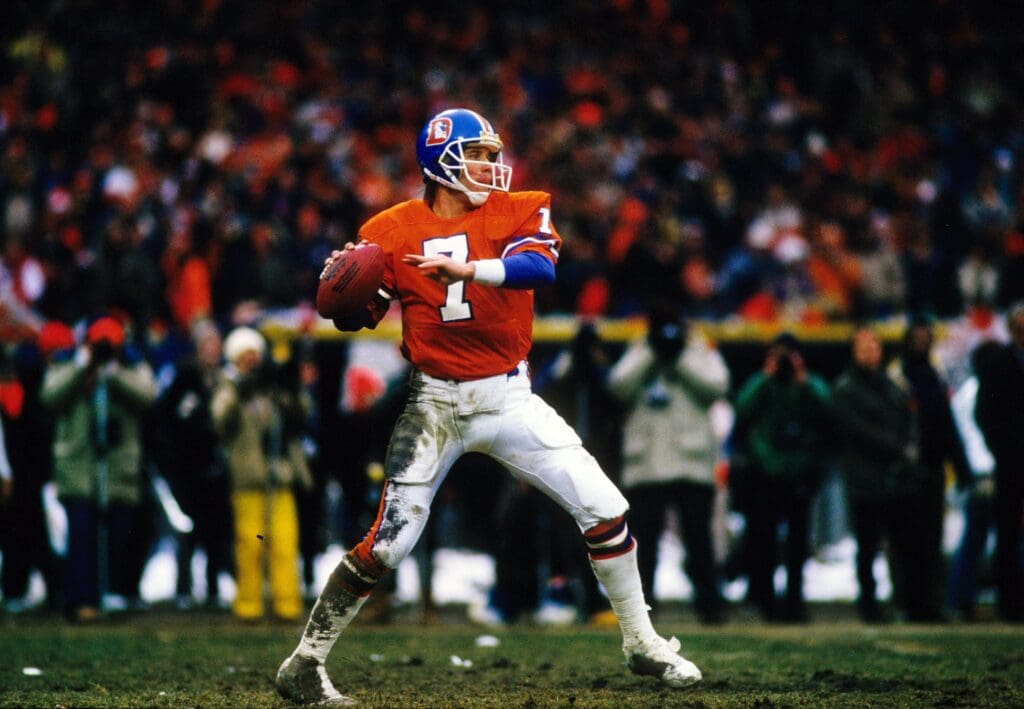 Jan 11, 1987; Cleveland, OH, USA; FILE PHOTO; Denver Broncos quarterback (7) John Elway against the Cleveland Browns during the 1986 AFC Championship Game at Cleveland Stadium. Elway directed the offense in the last minute of regulation to tie the score in what is known as "the drive". The Broncos defeated the Browns 23-20 in overtime.