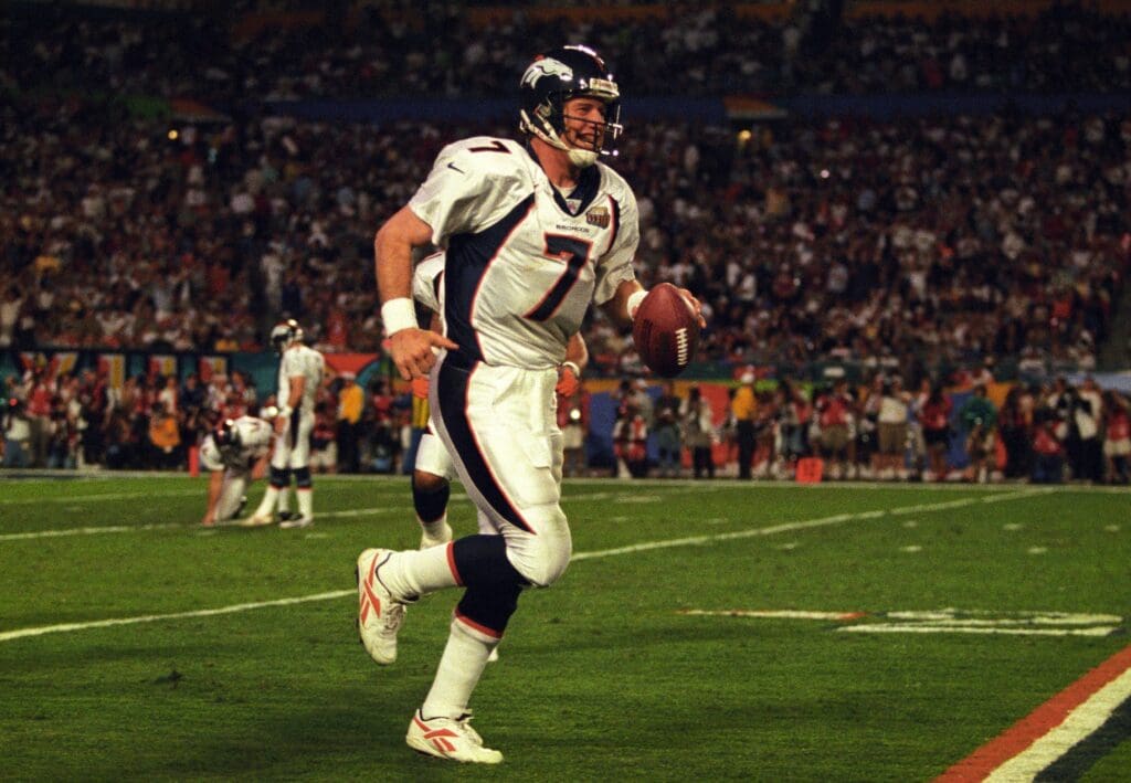 Jan 31, 1999; Miami, FL, USA; FILE PHOTO; Denver Broncos quarterback John Elway (7) celebrates after a touchdown against the Atlanta Falcons during Super Bowl XXXIII at Dolphin Stadium. The Broncos defeated the Falcons 34-19.